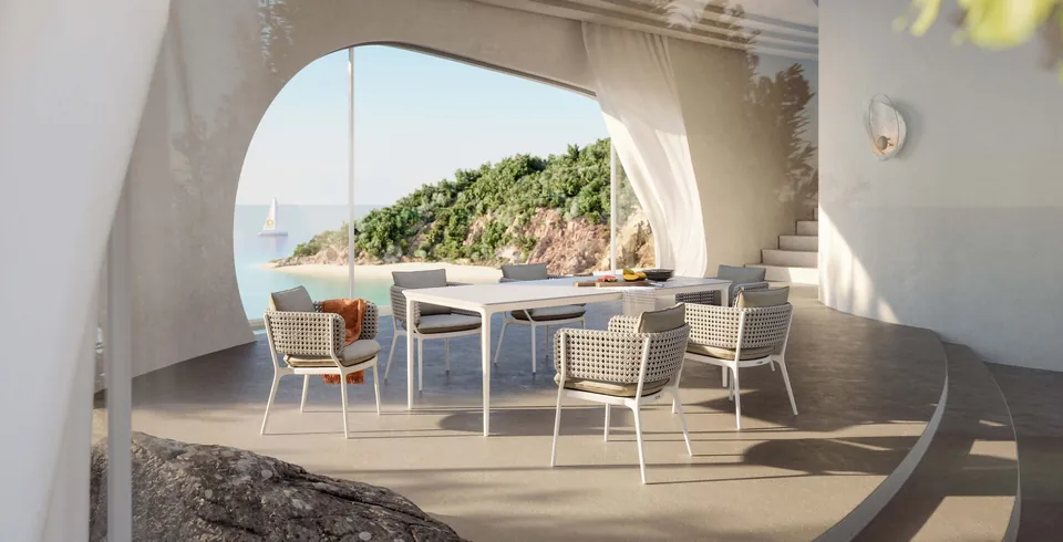 Dedon Bellmonde dining table and woven armchairs, outdoor seating on a terrace