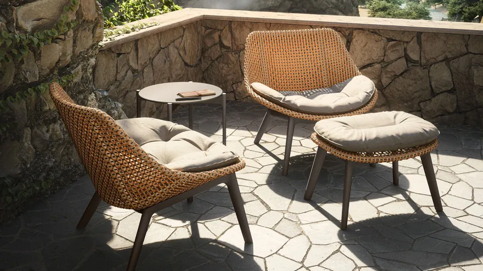 Dedon Izon coffee table with an HPL top, a layered outdoor table set