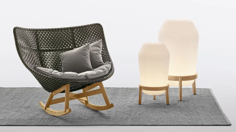 Dedon Loon floor lamp with a teak stand, lighting for outdoor furniture on a terrace