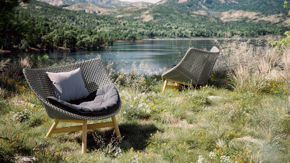 Dedon outdoor patio furniture, Mbrace wing chair woven in Dedon Fiber on a terrace
