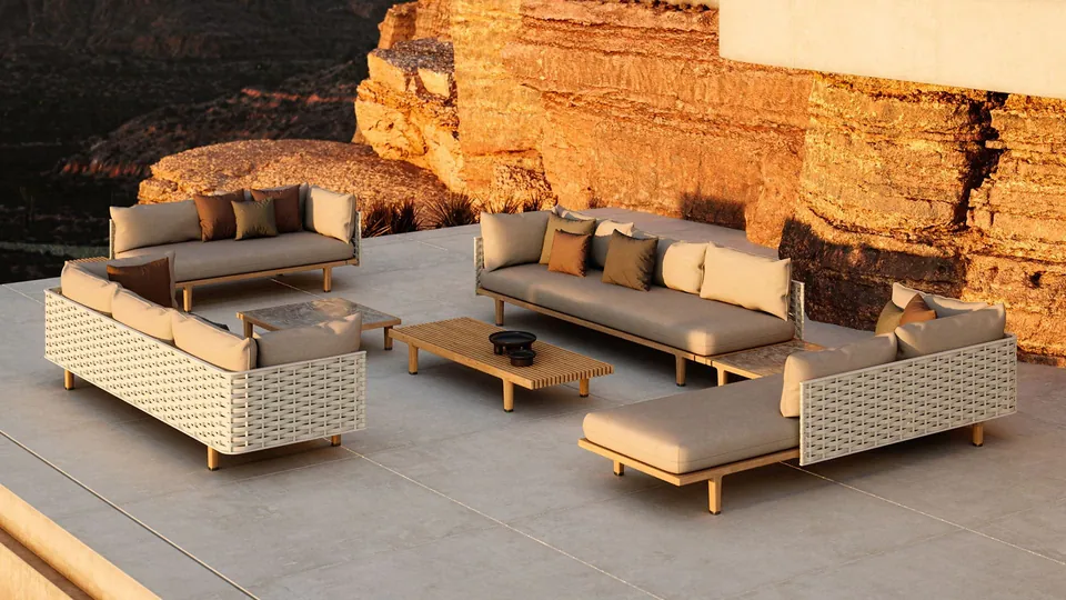 Dedon Sealine outdoor sectional with a teak frame and woven Dedon Fiber back on a deck